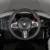 Masinuta electrica pentru copii BMW M4 Painted Black 12V 90W cu echipare premium ,deschidere usi si licenta, panou audio, roti din spuma Eva, pornire la buton, lumini si telecomanda