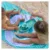 Prosop de plaja cu activitati Quut Toys 140 x 70 cm